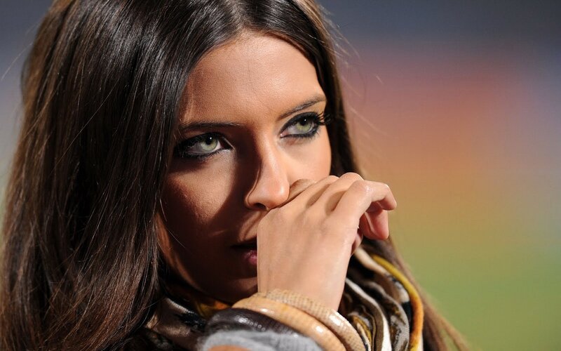 woman with green eyes looking thoughtfully