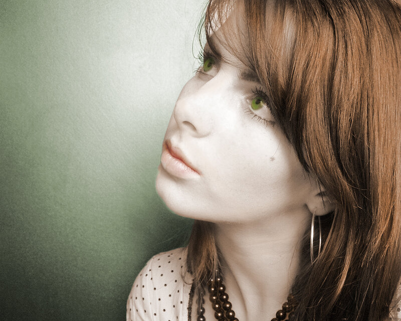 woman with green eyes looking up