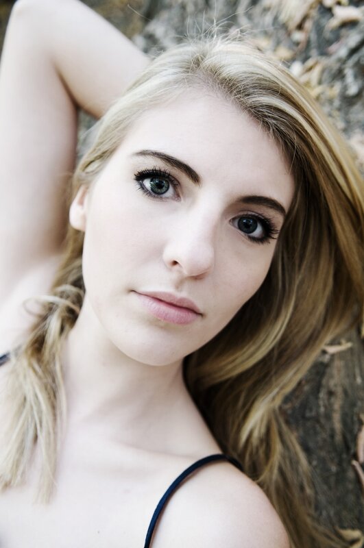 woman with green eyes lying down