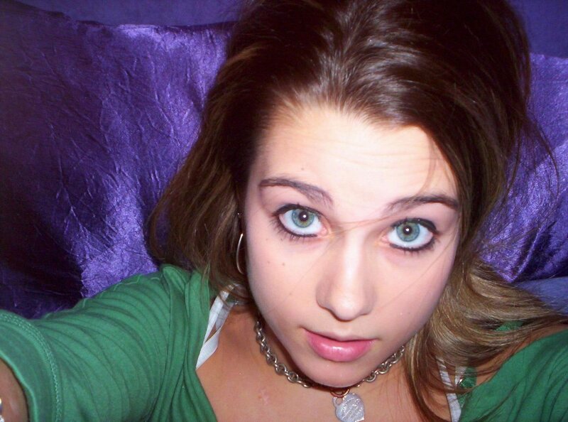 woman with green eyes lying down