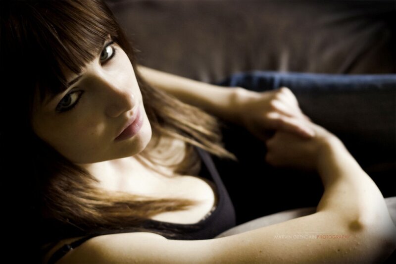 woman with green eyes lying down