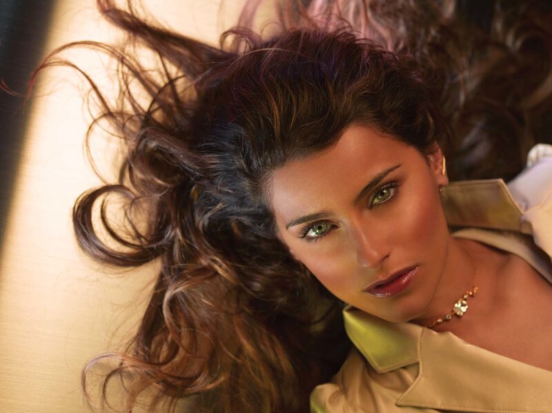 woman with green eyes lying down