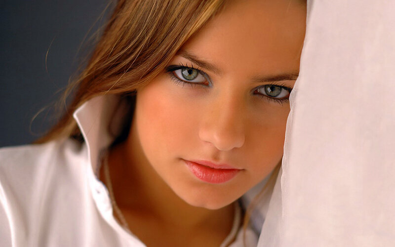 woman with green eyes peeking