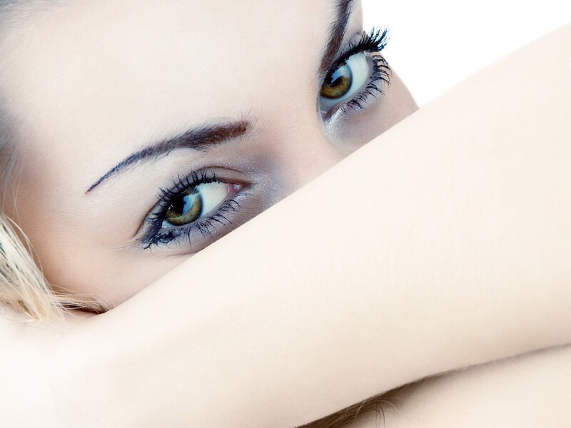 woman with green eyes peeking