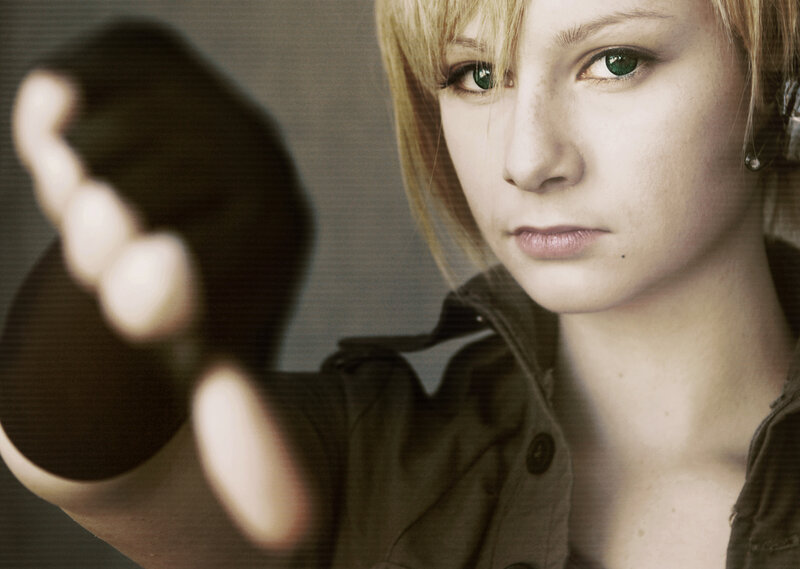 woman with green eyes reaching forward