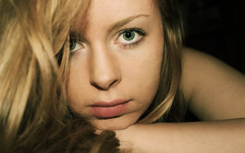woman with green eyes resting