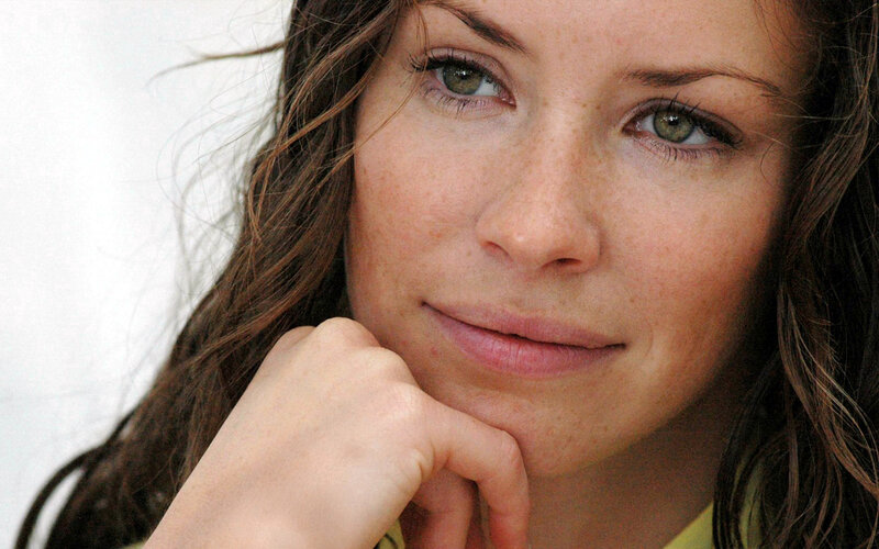 woman with green eyes resting hand
