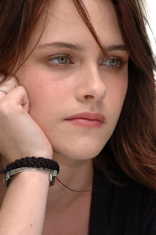 woman with green eyes resting hand