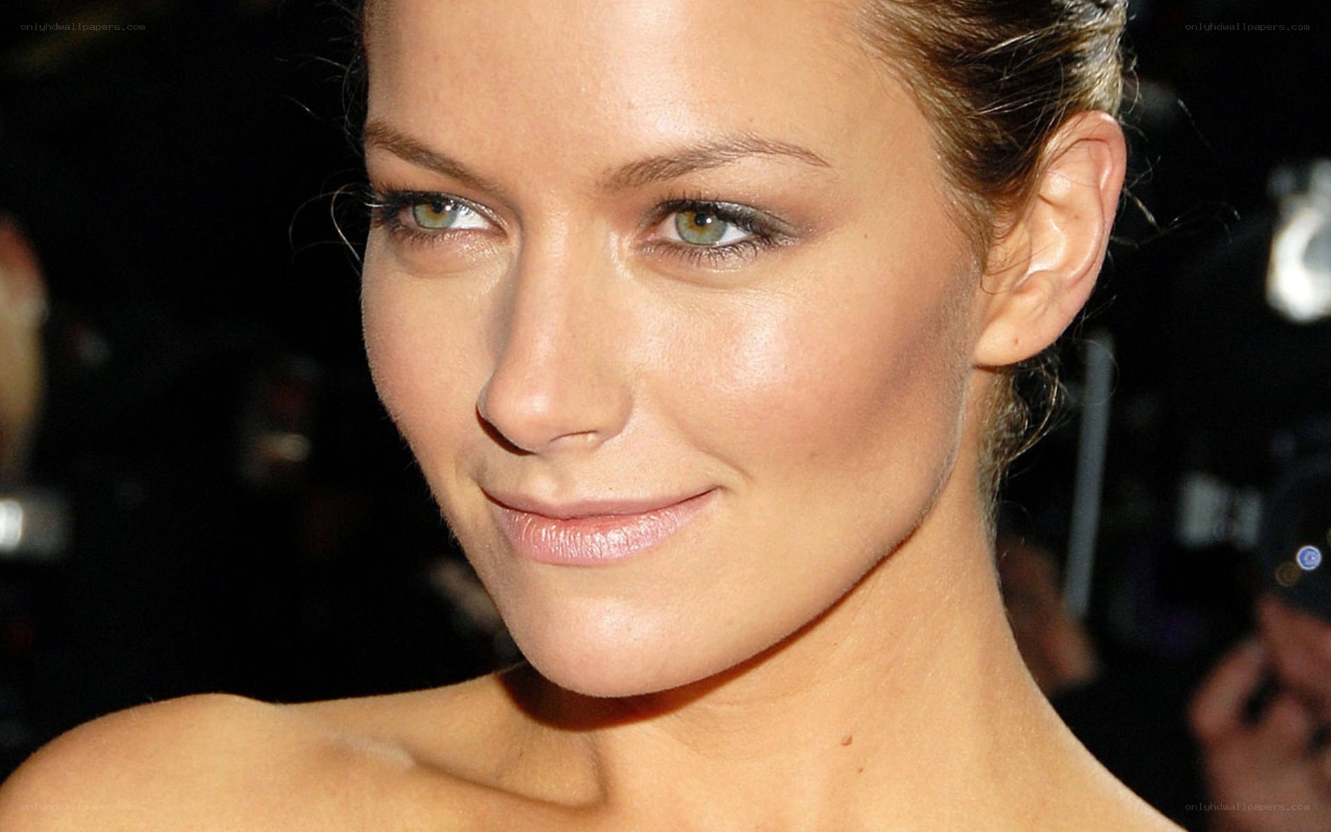 woman with green eyes smiling