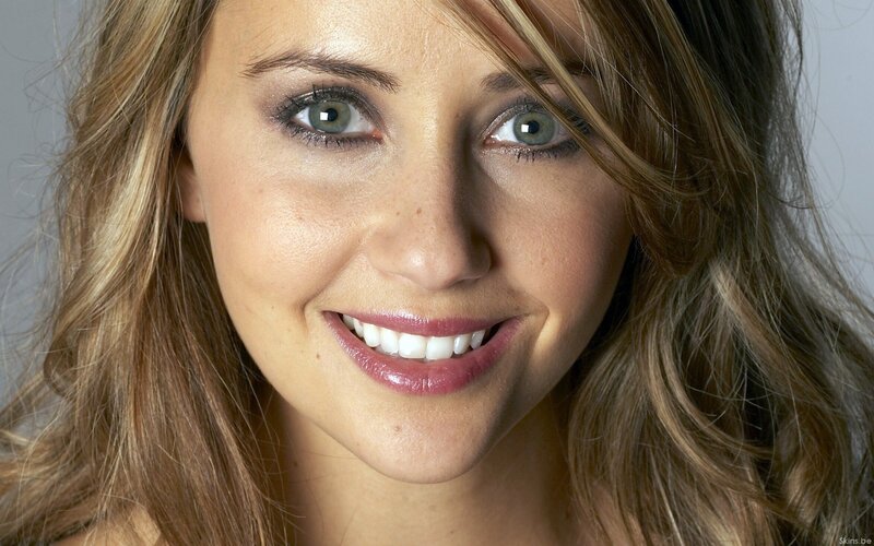woman with green eyes smiling