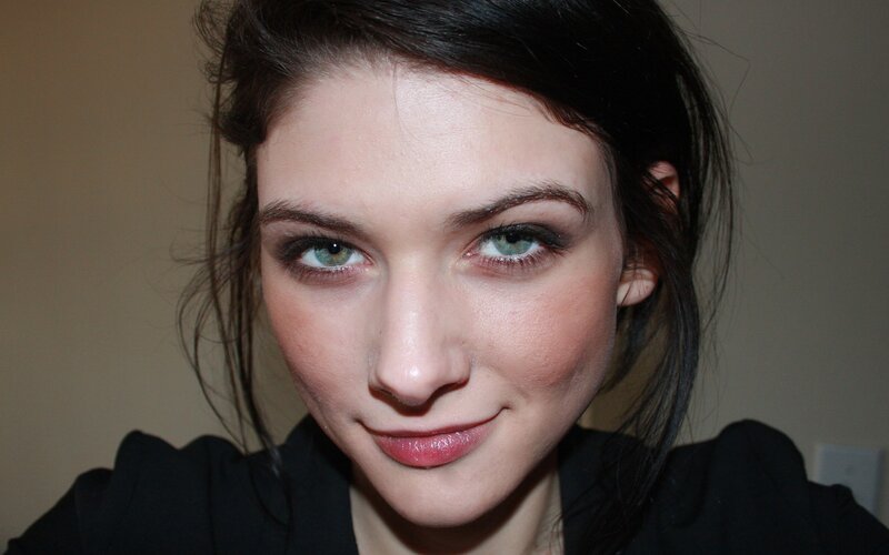 woman with green eyes smiling