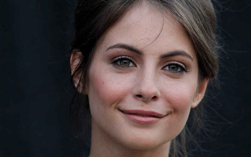 woman with green eyes smiling