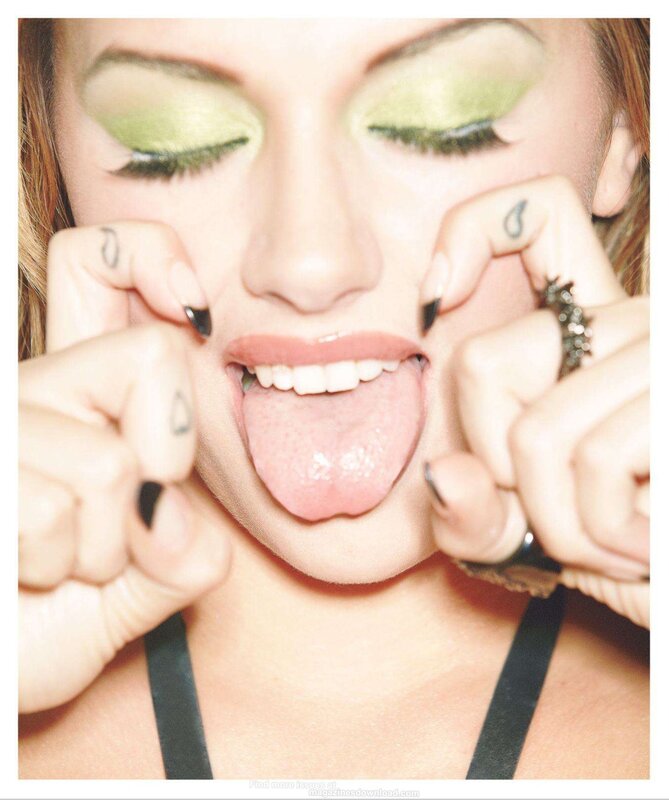woman with green eyeshadow sticking out tongue
