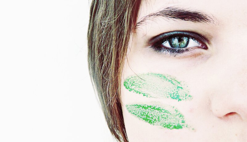 woman with green face paint