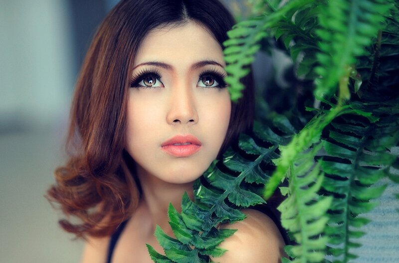 woman with green ferns