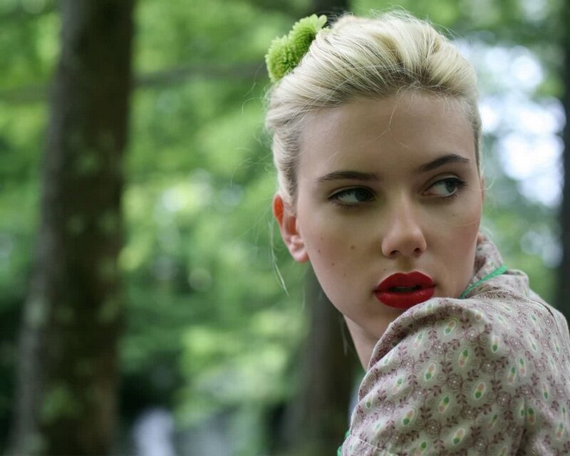 woman with green flower in hair