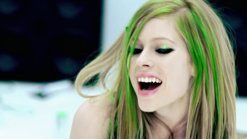 woman with green hair singing