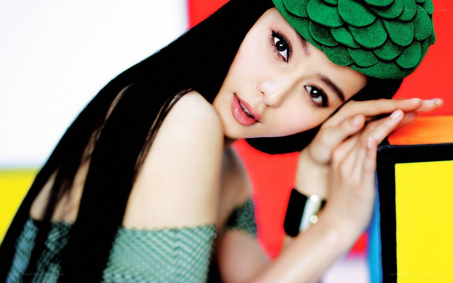 woman with green hat posing