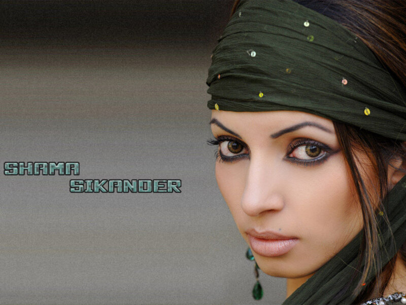 Woman with Green Headscarf — Serious
