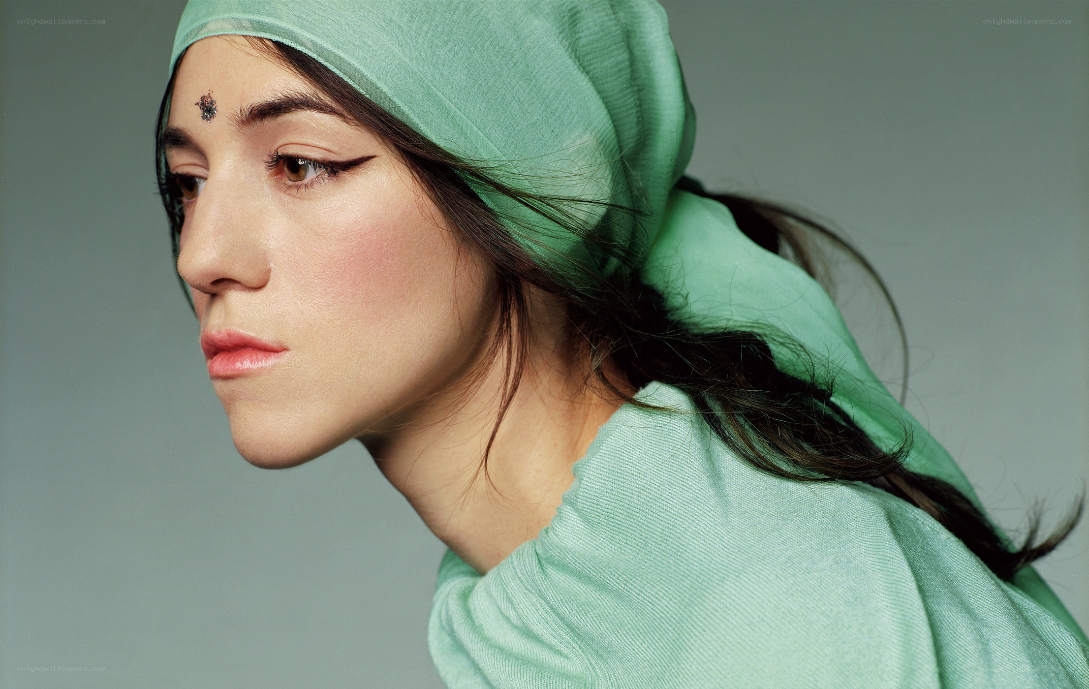 woman with green headscarf