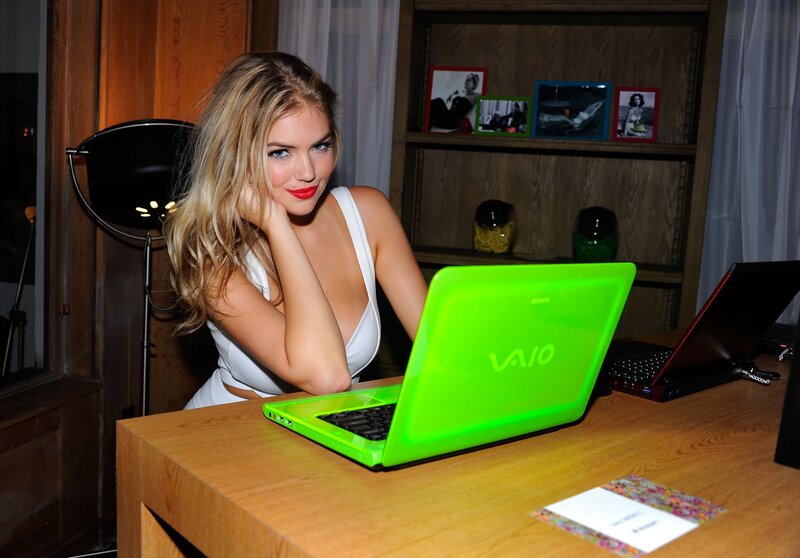 woman with green laptop