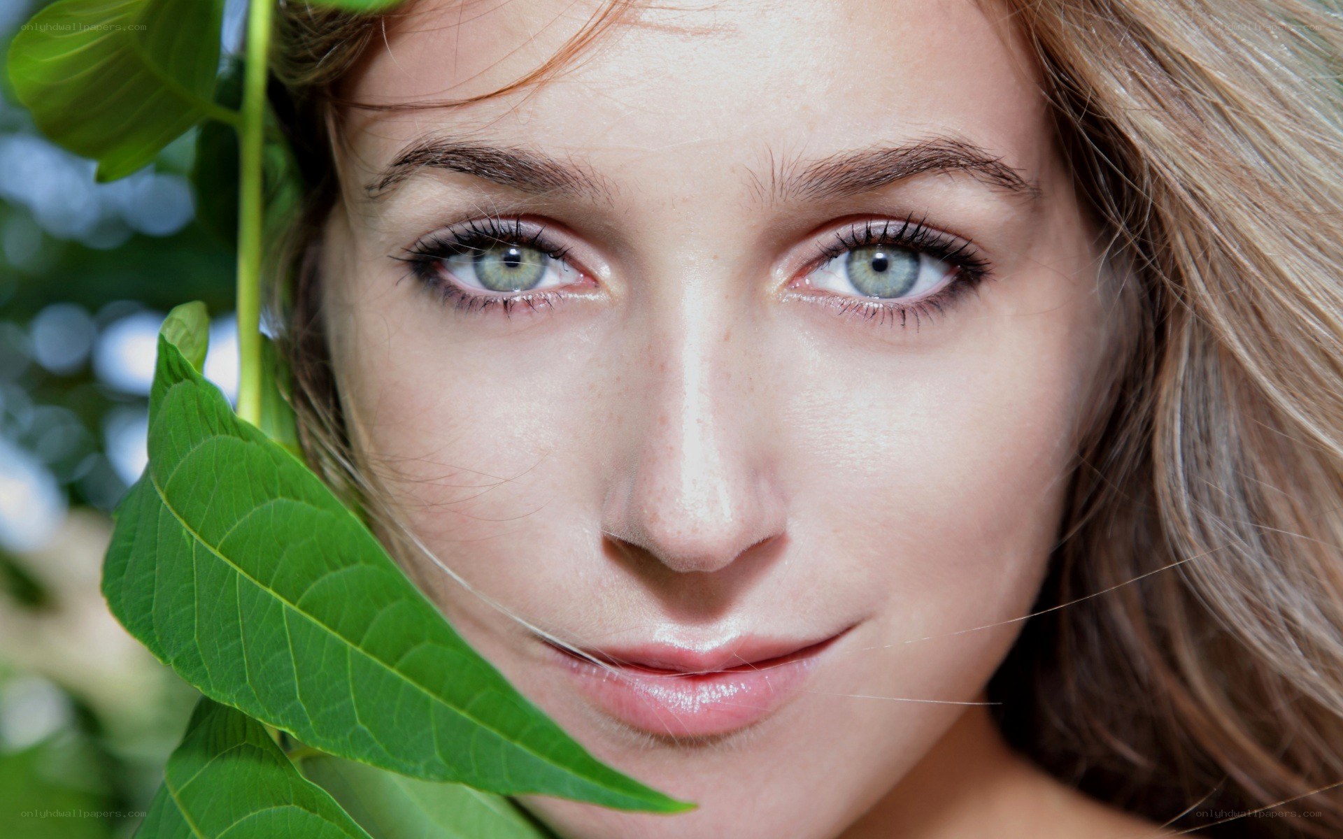woman with green leaf