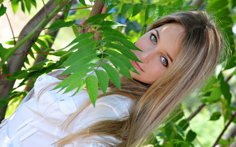 woman with green leaves