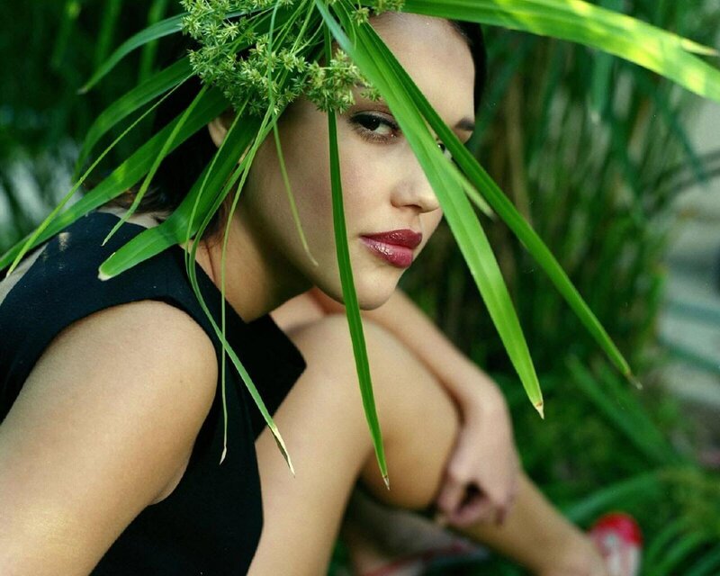 woman with green leaves