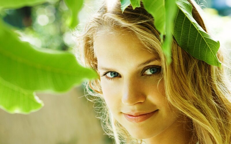 woman with green leaves