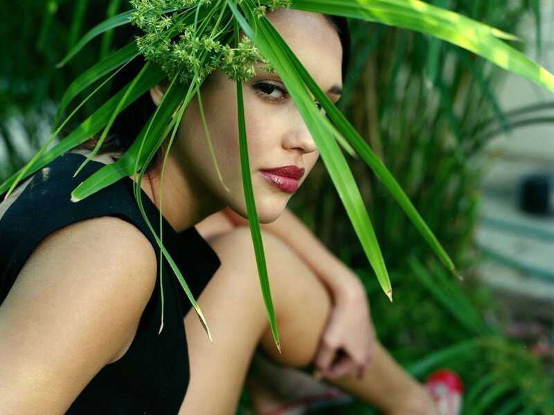 woman with green leaves
