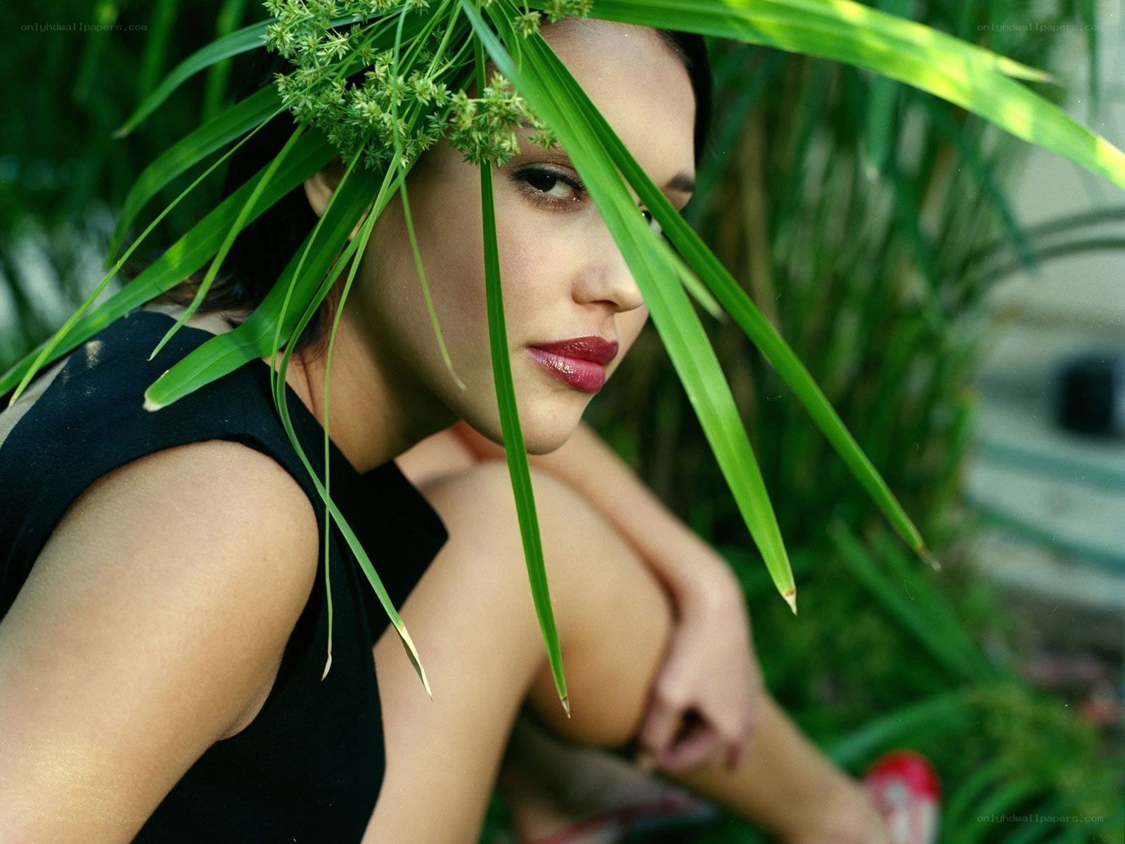 woman with green leaves