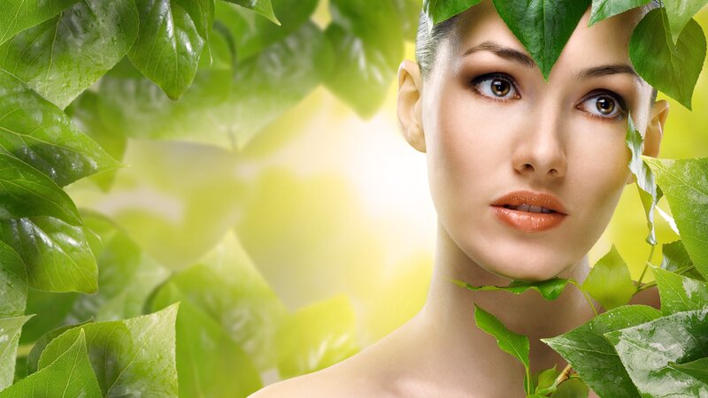woman with green leaves