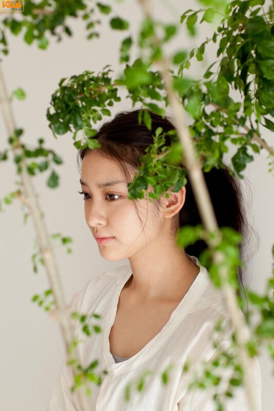 woman with green leaves