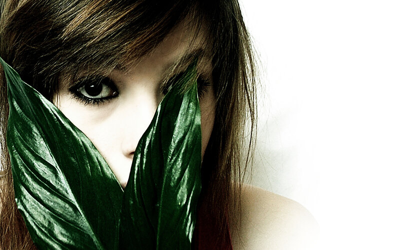 Woman with Green Leaves — Dramatic