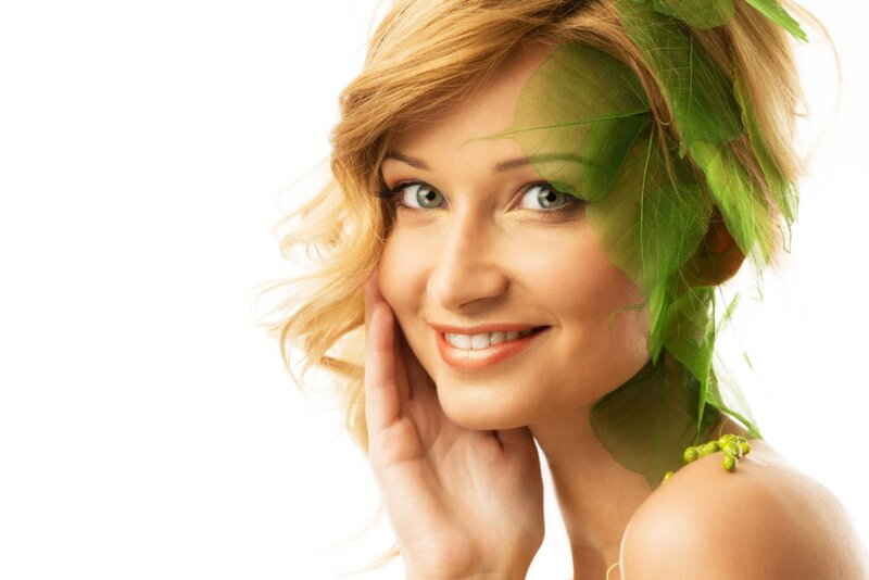 Woman with Green Leaves — Serene, Photograph, Hand