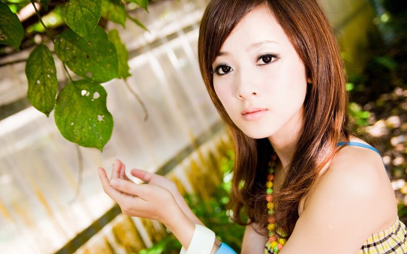 woman with green leaves