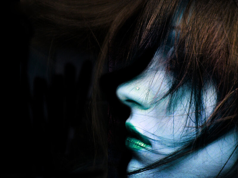 woman with green lips in profile