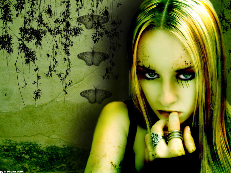 woman with green makeup and butterflies