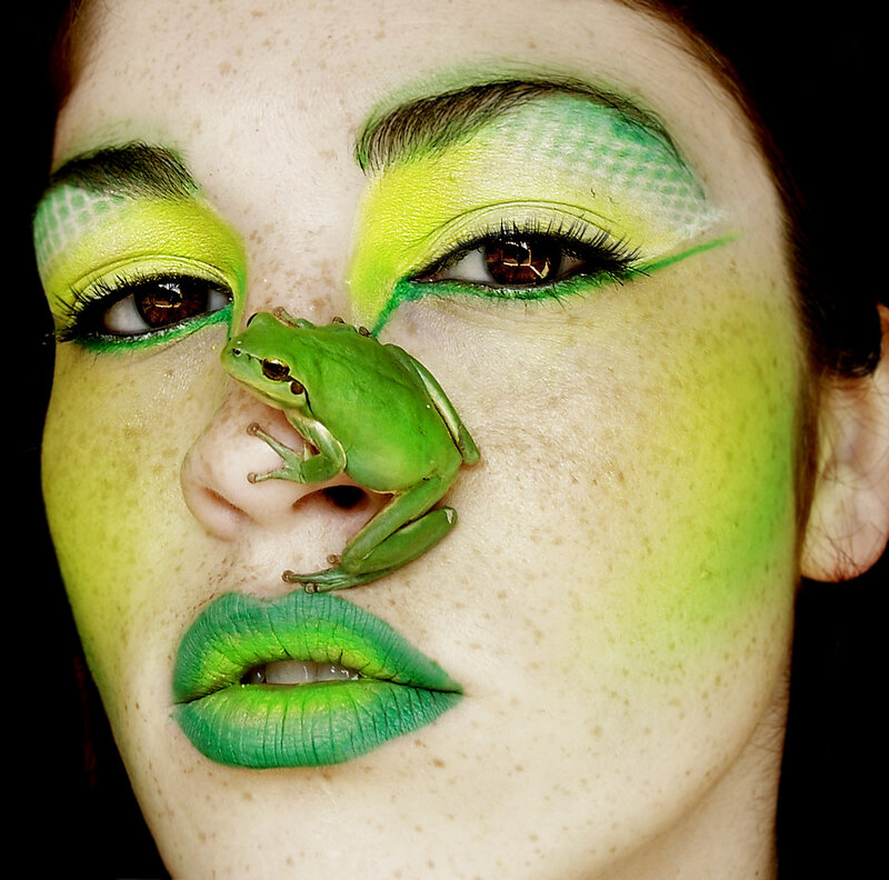 woman with green makeup and frog