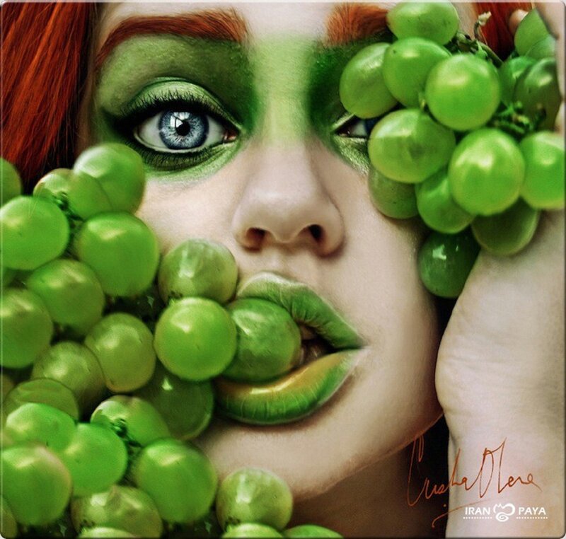 woman with green makeup and grapes