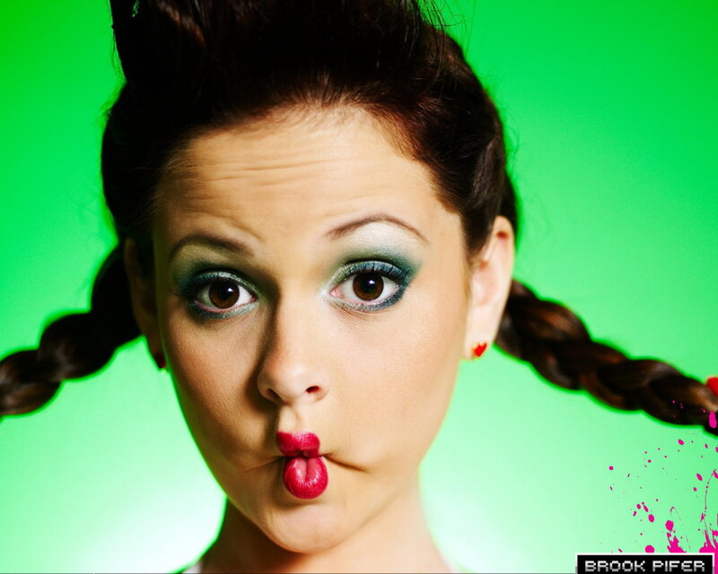 woman with green makeup and pigtails