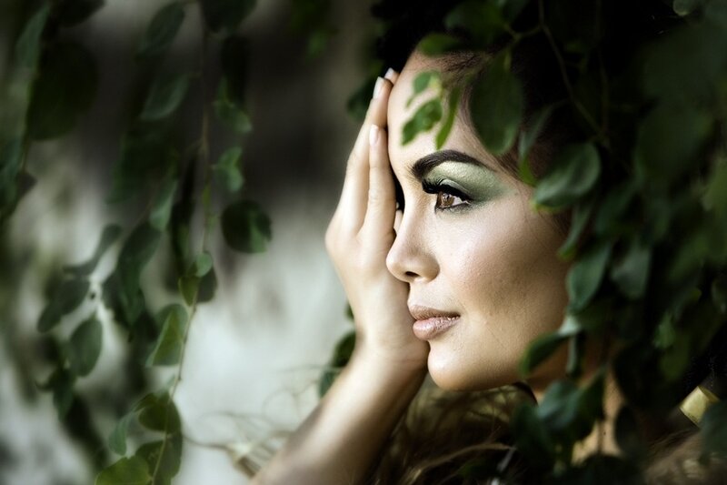 Woman with Green Makeup — Contemplative