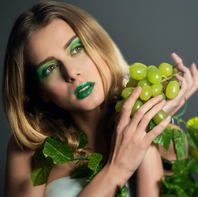 Woman with Green Makeup — Dramatic, Photograph, Grapes