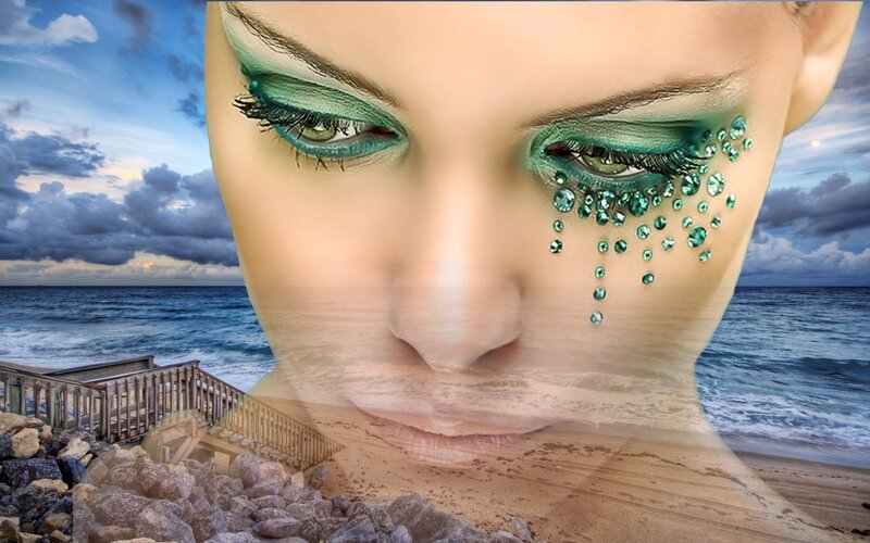 woman with green makeup on beach