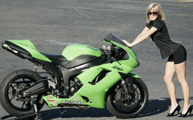 Woman with green motorcycle