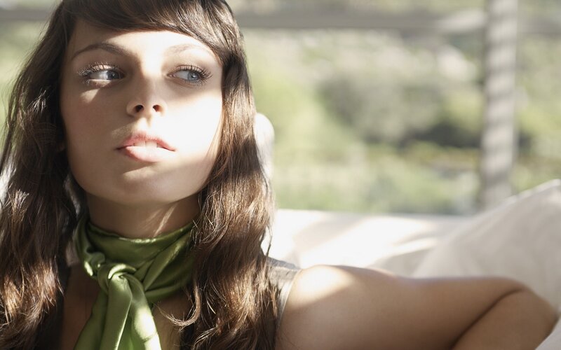 woman with green scarf in sunlight