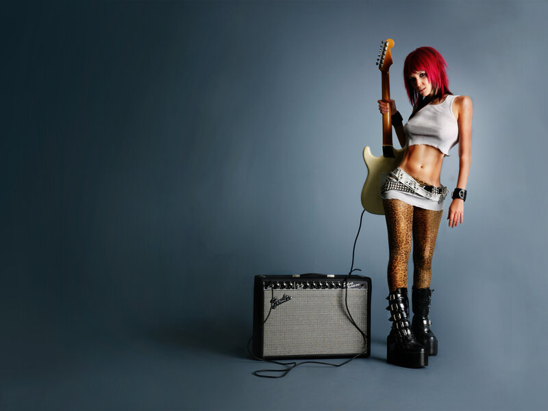 woman with guitar and amp