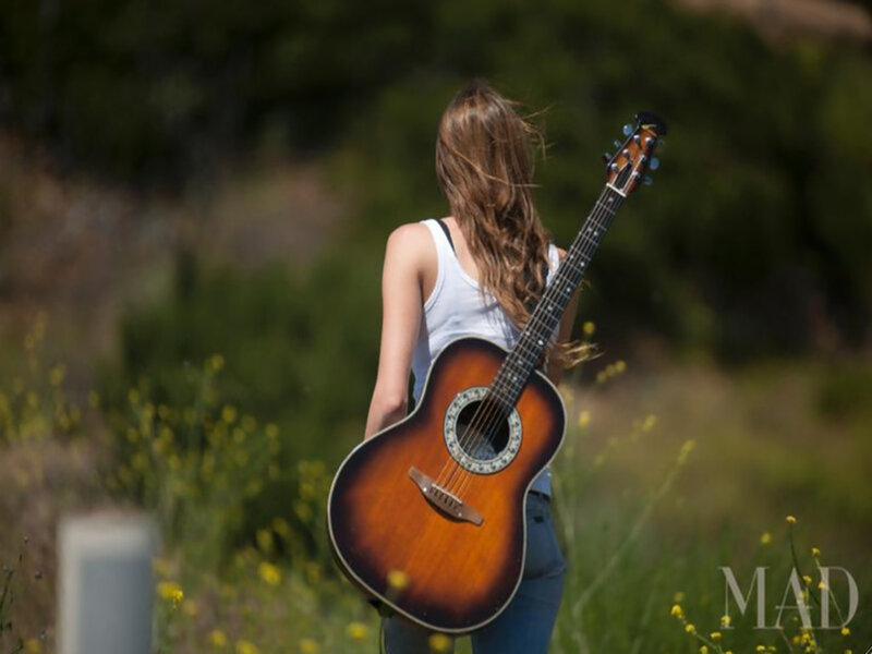 Woman with Guitar — Brown, Serene