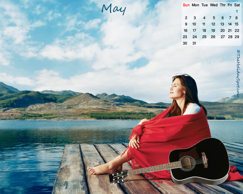 Woman with guitar by lake
