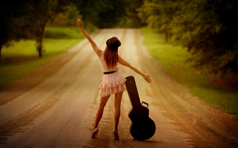 Woman with Guitar Case — Green